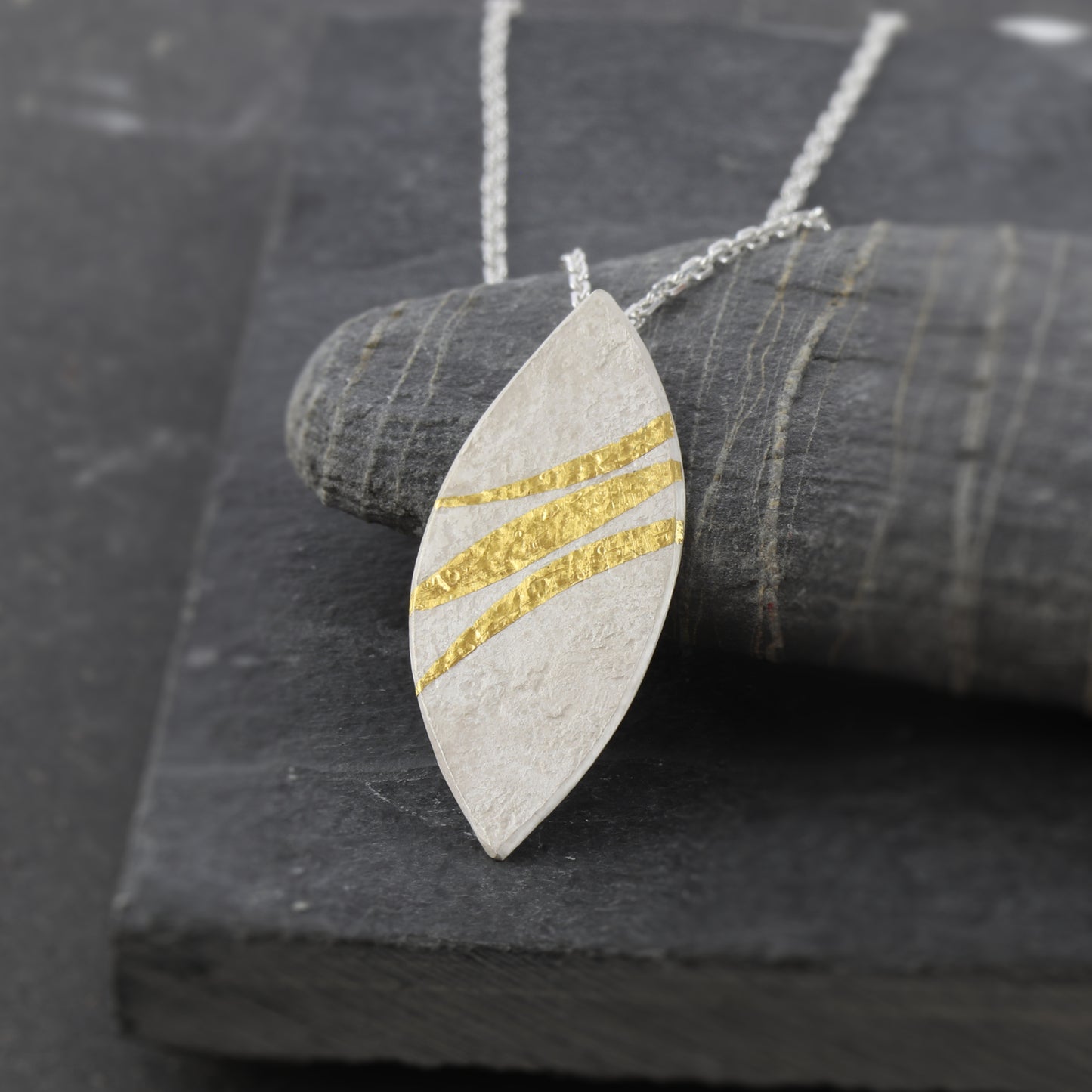 Handcrafted sterling silver marquise necklace with 24ct gold Keum-Boo ribbons by Jenny Holdsworth