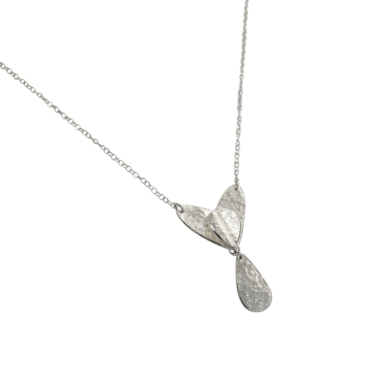 Silver necklace with a leaf-shaped pendant on a white background