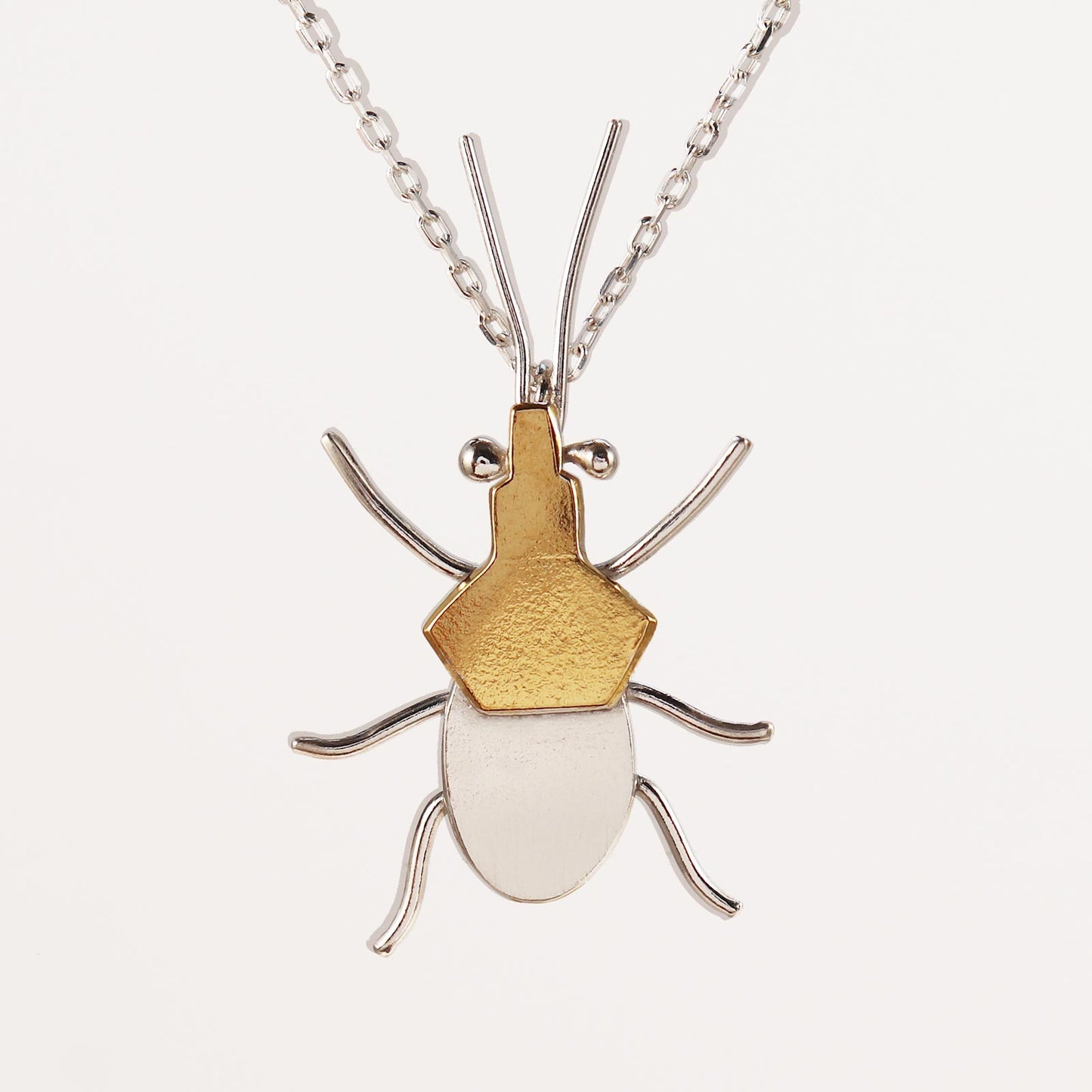 Sterling silver and gold assassin bug necklace