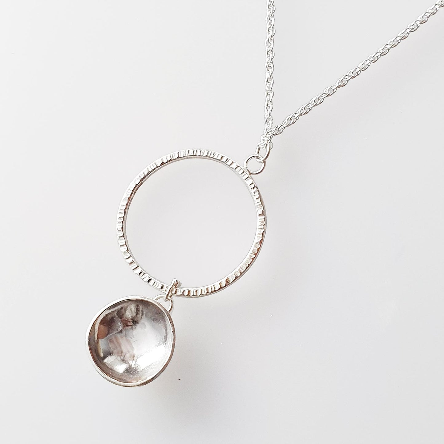 Sterling silver circle and dome pendant necklace