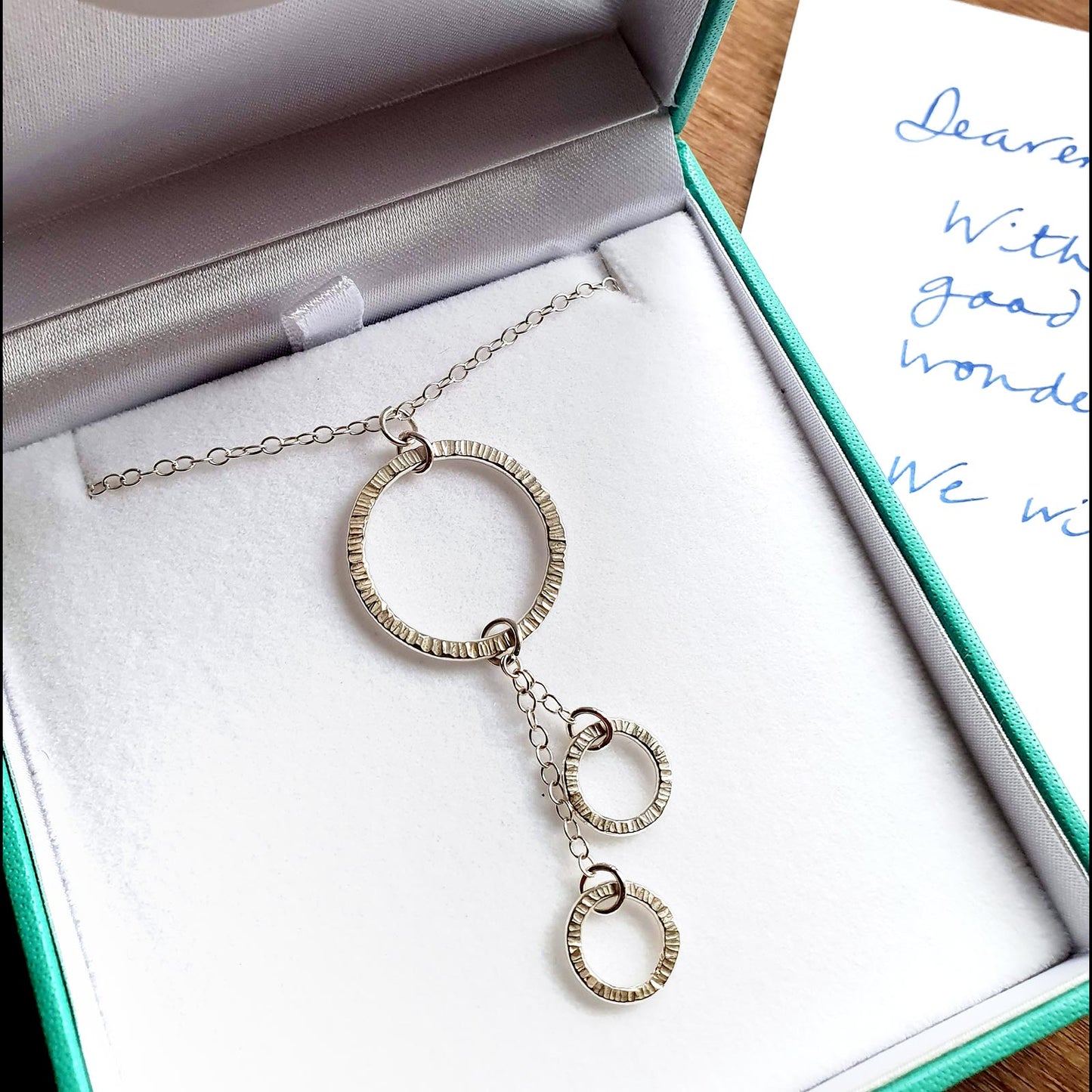 Drop necklace with textured circles