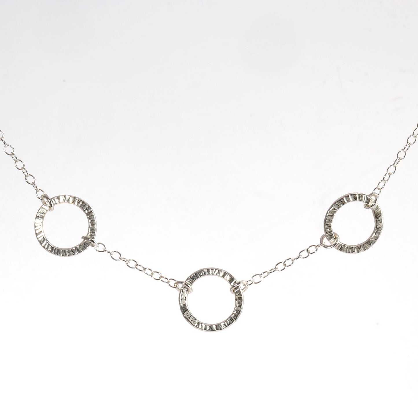 Necklace with three small circles