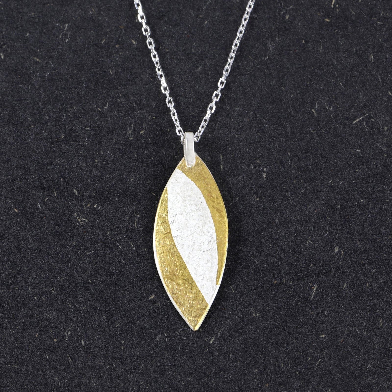 Handcrafted sterling silver marquise pendant with 24ct gold Keum-Boo sweeps by Jenny Holdsworth