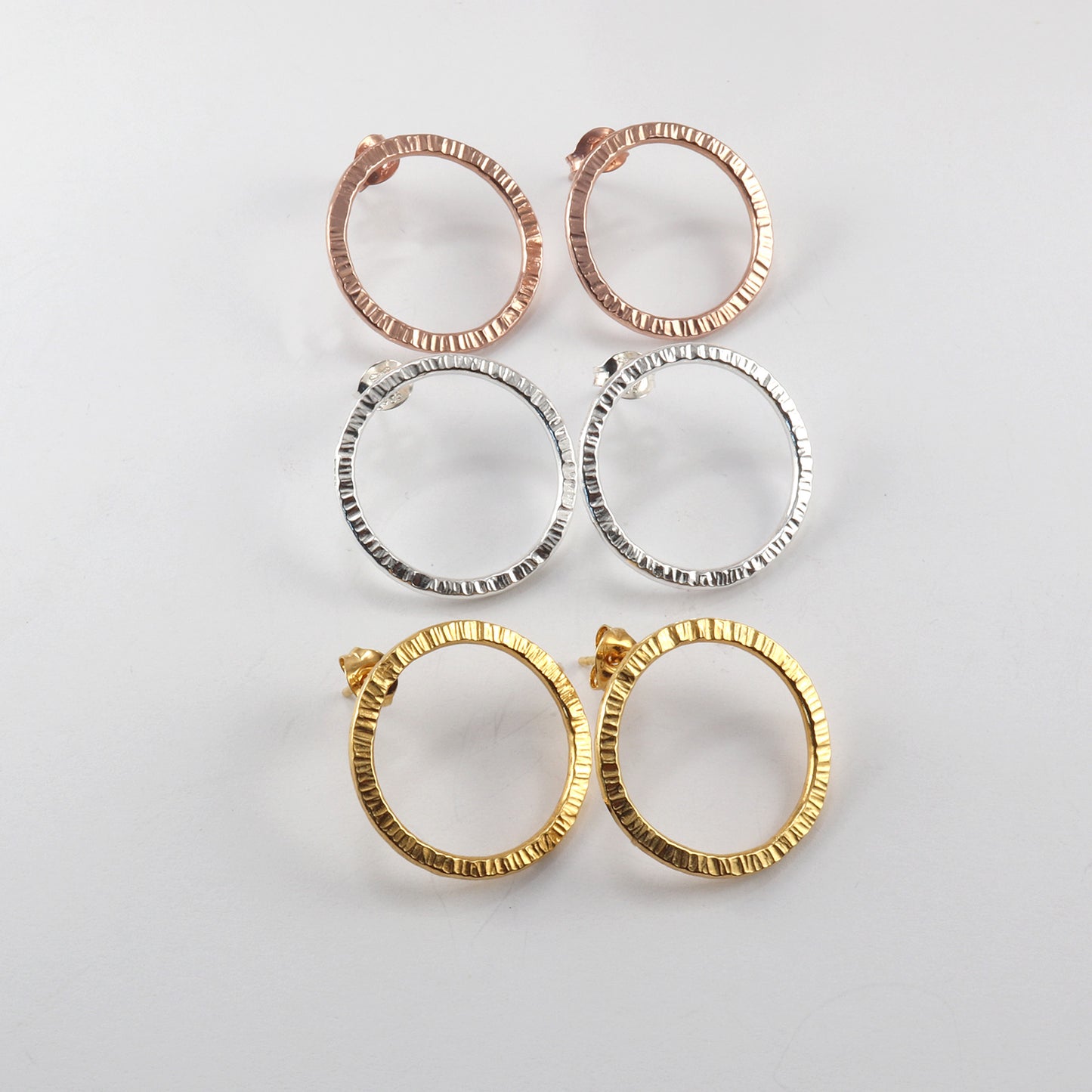 handmade earrings in circle design in silver and gold