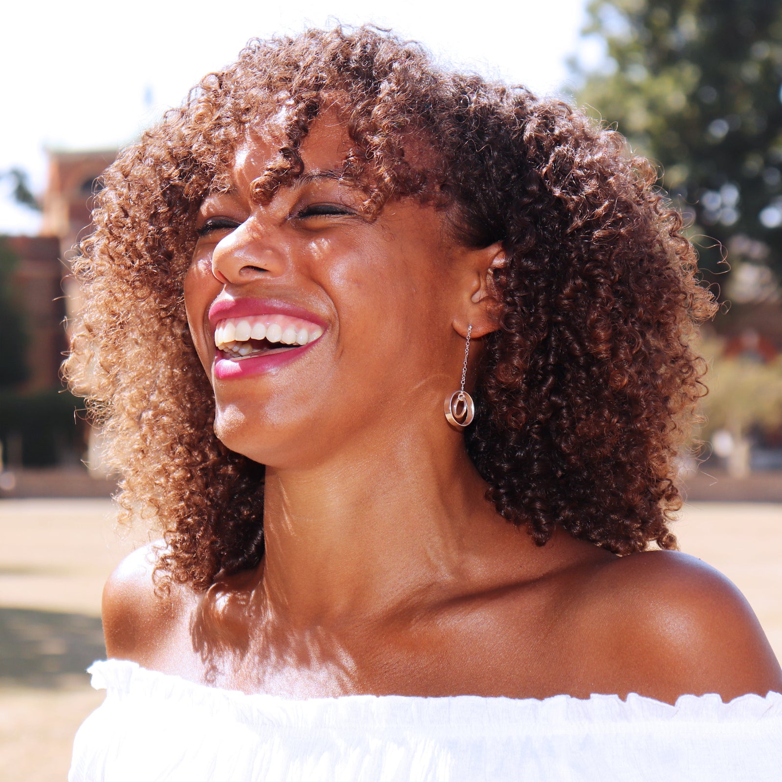 Sterling silver linked circle drop earrings worn on the ear