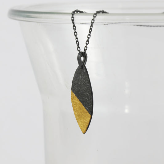 Handcrafted sterling silver marquise pendant with oxidised finish and 24ct gold Keum-Boo detail by Jenny Holdsworth