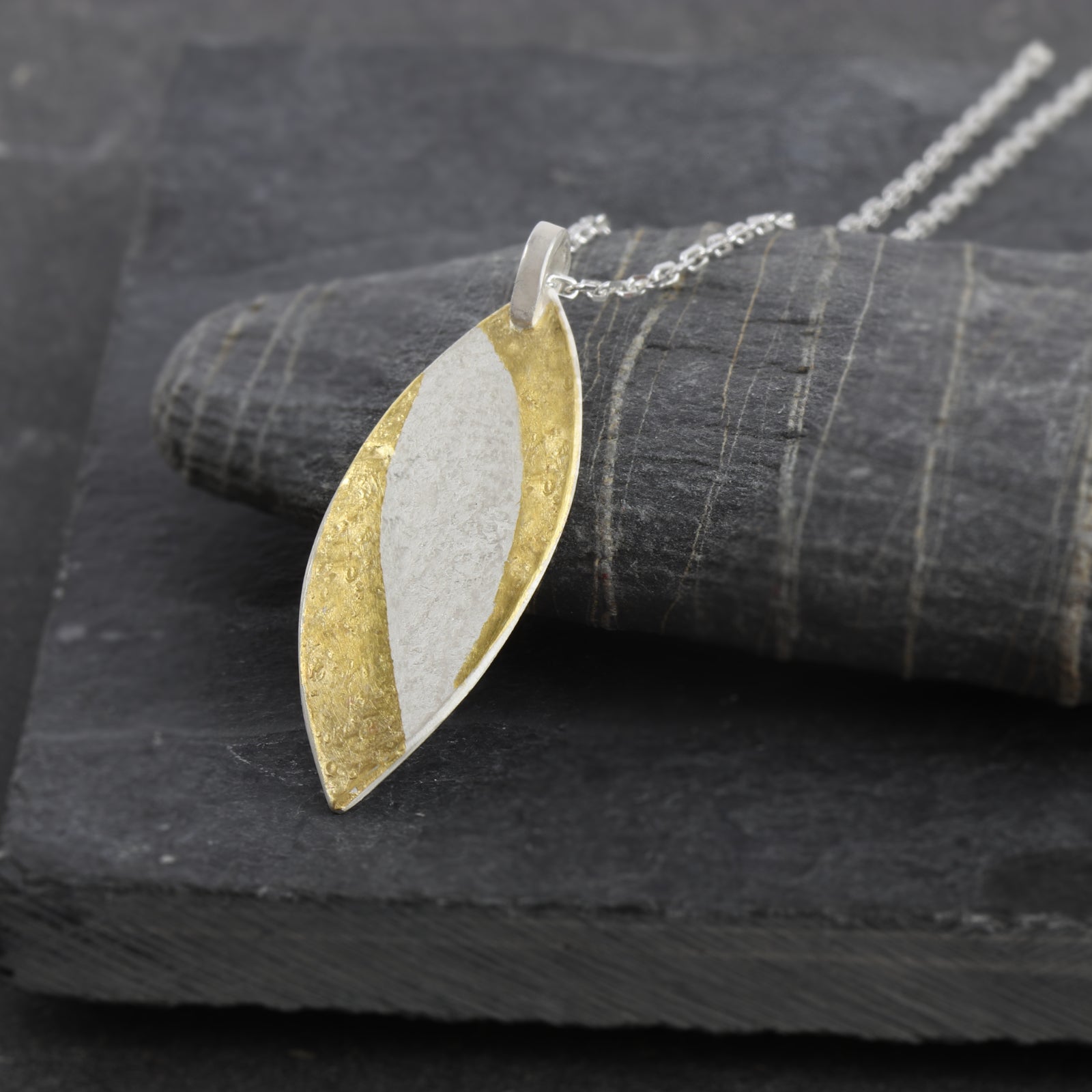 Handcrafted sterling silver marquise pendant with 24ct gold Keum-Boo detail by Jenny Holdsworth