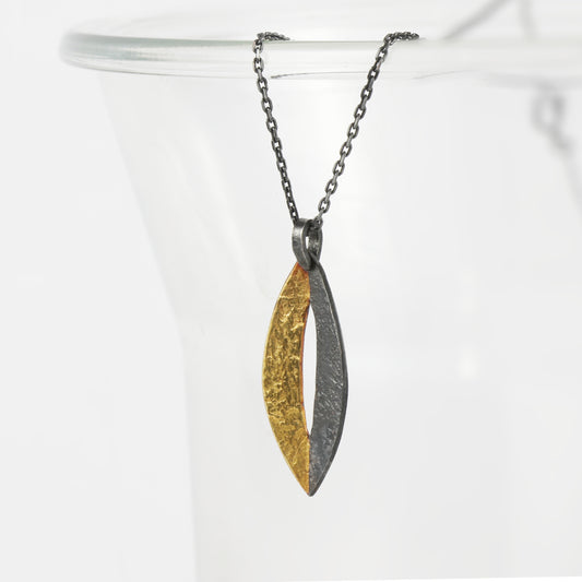 Handcrafted sterling silver marquise pendant with oxidised finish and 24ct gold Keum-Boo detail by Jenny Holdsworth
