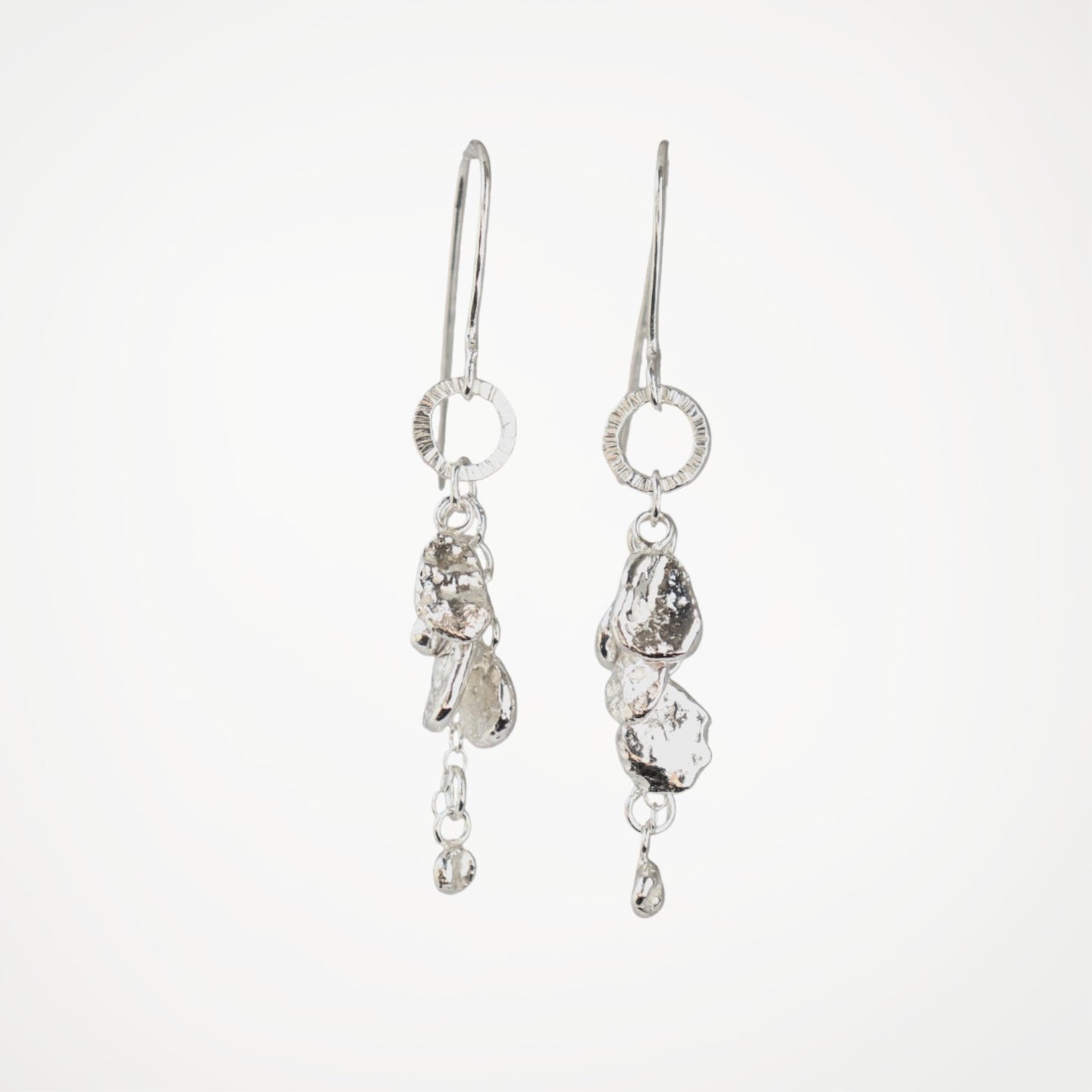 Handmade Molten Drops silver drop earrings showing molten silver details