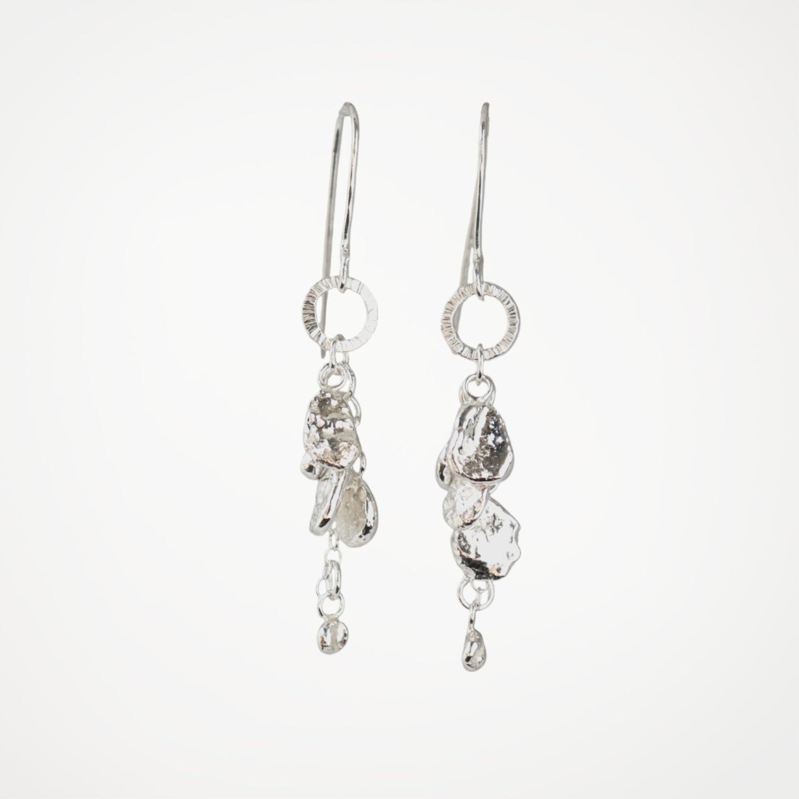 Handmade Molten Drops silver drop earrings showing molten silver details