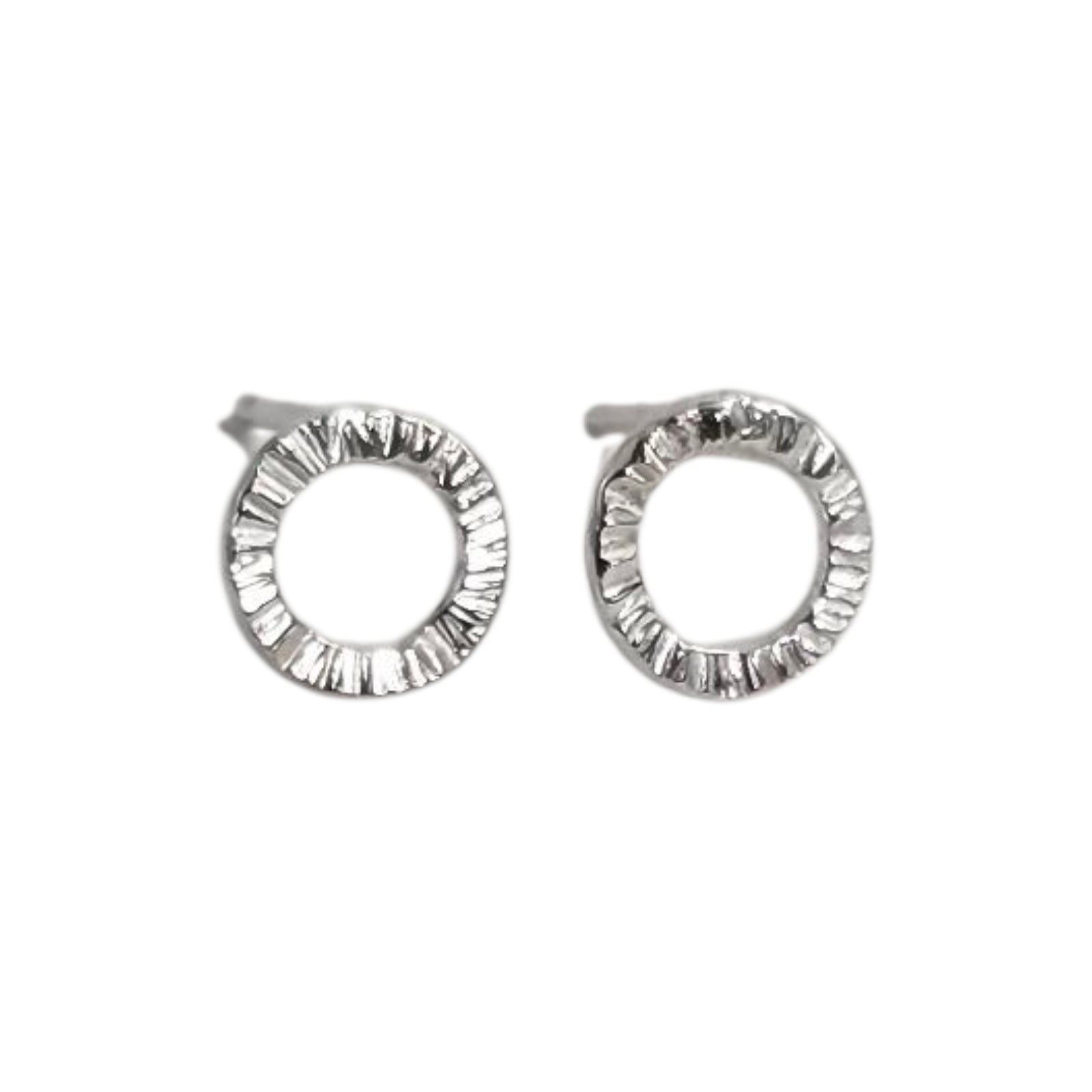 Pair of silver stud earrings on a white background