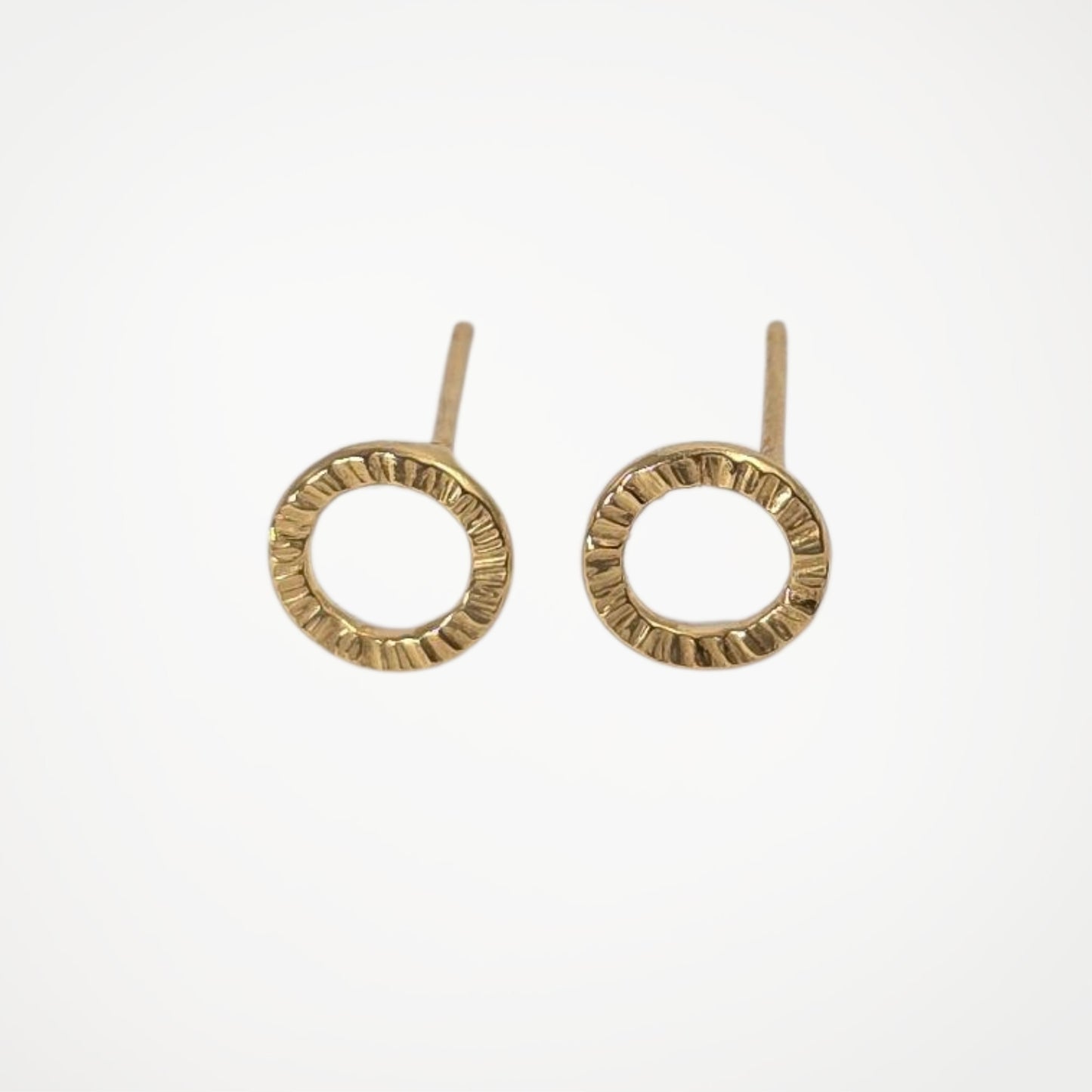 Pair of gold vermeil earrings on a white background