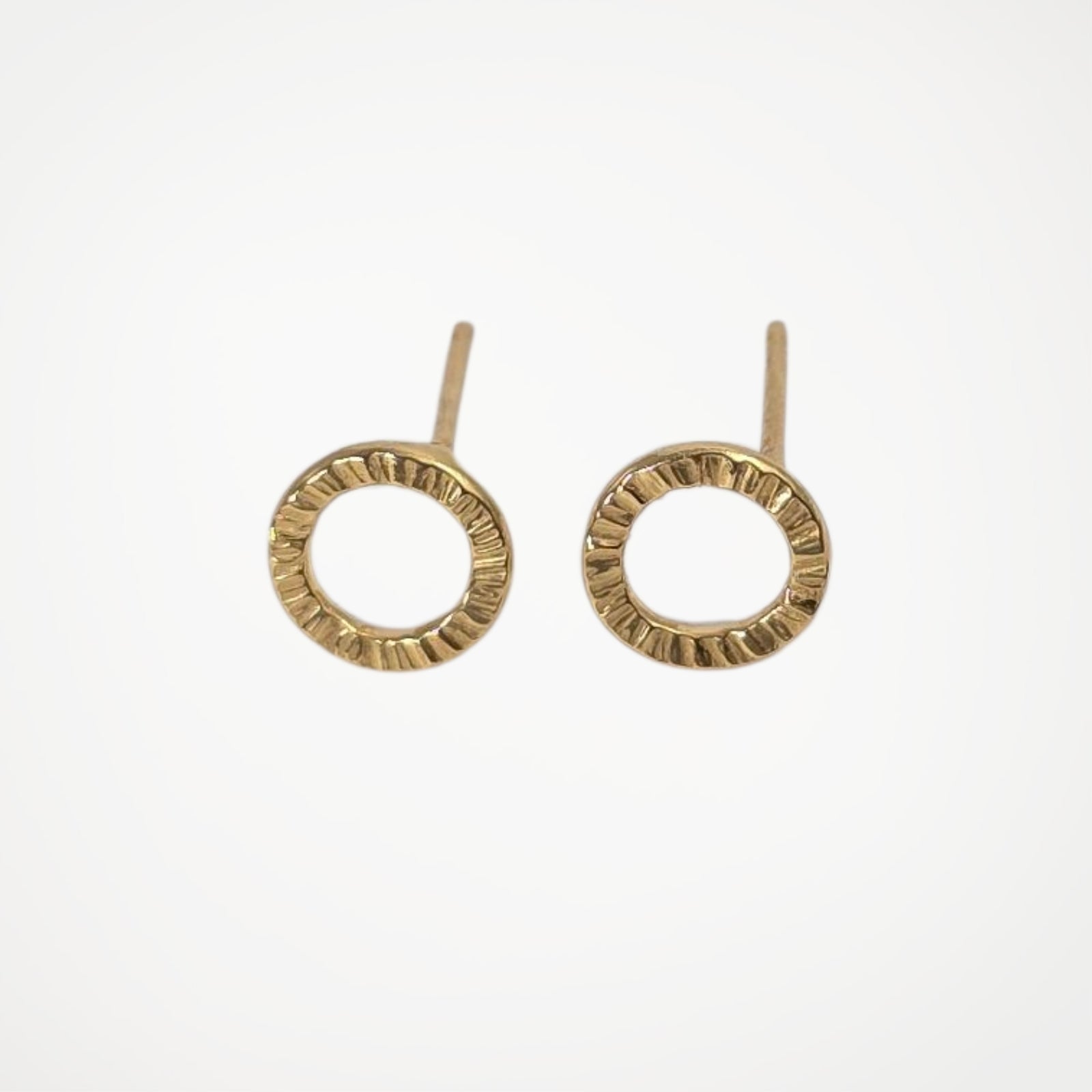 Pair of gold vermeil earrings on a white background