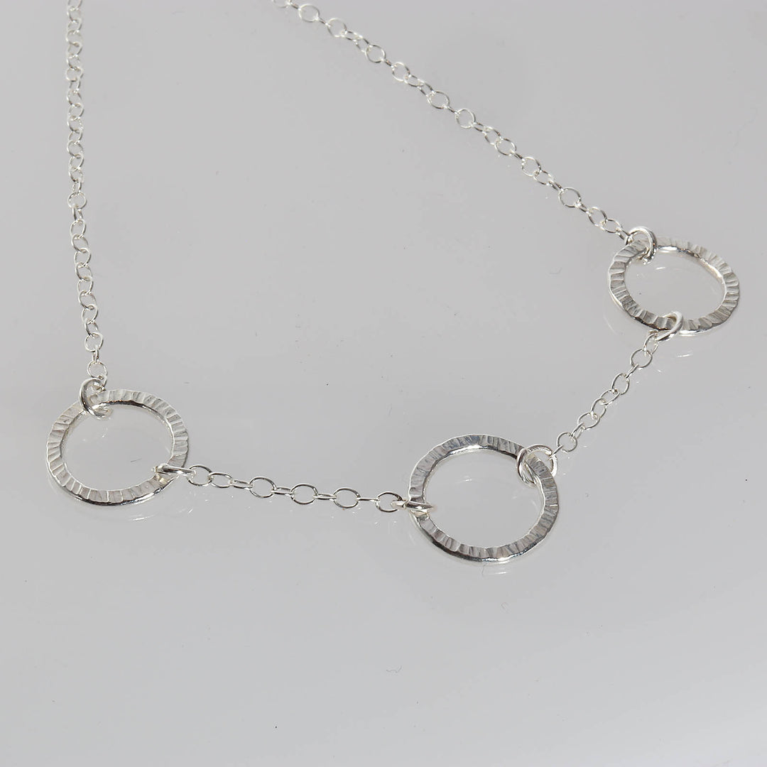 Necklace with three small circles