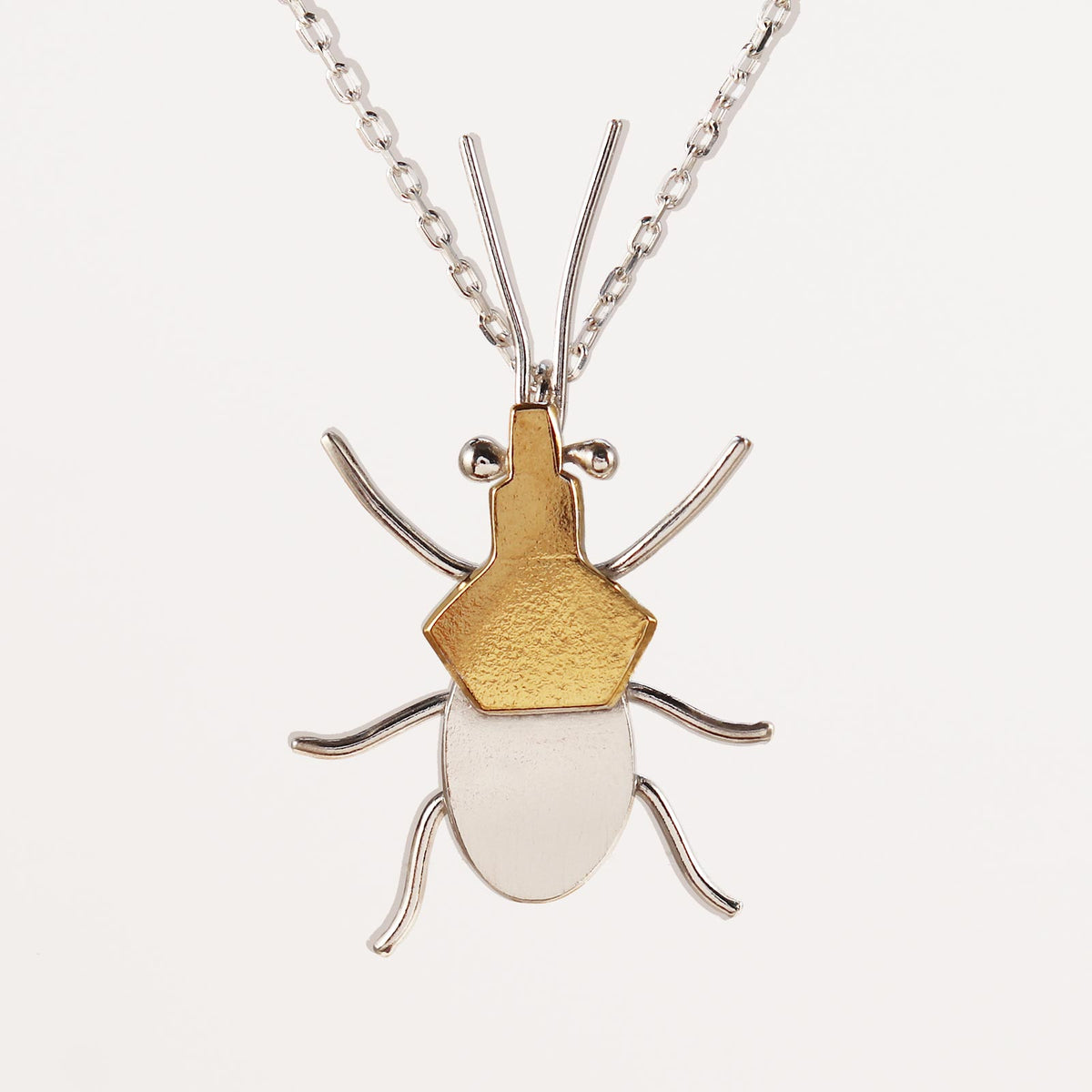 Sterling silver and gold assassin bug necklace