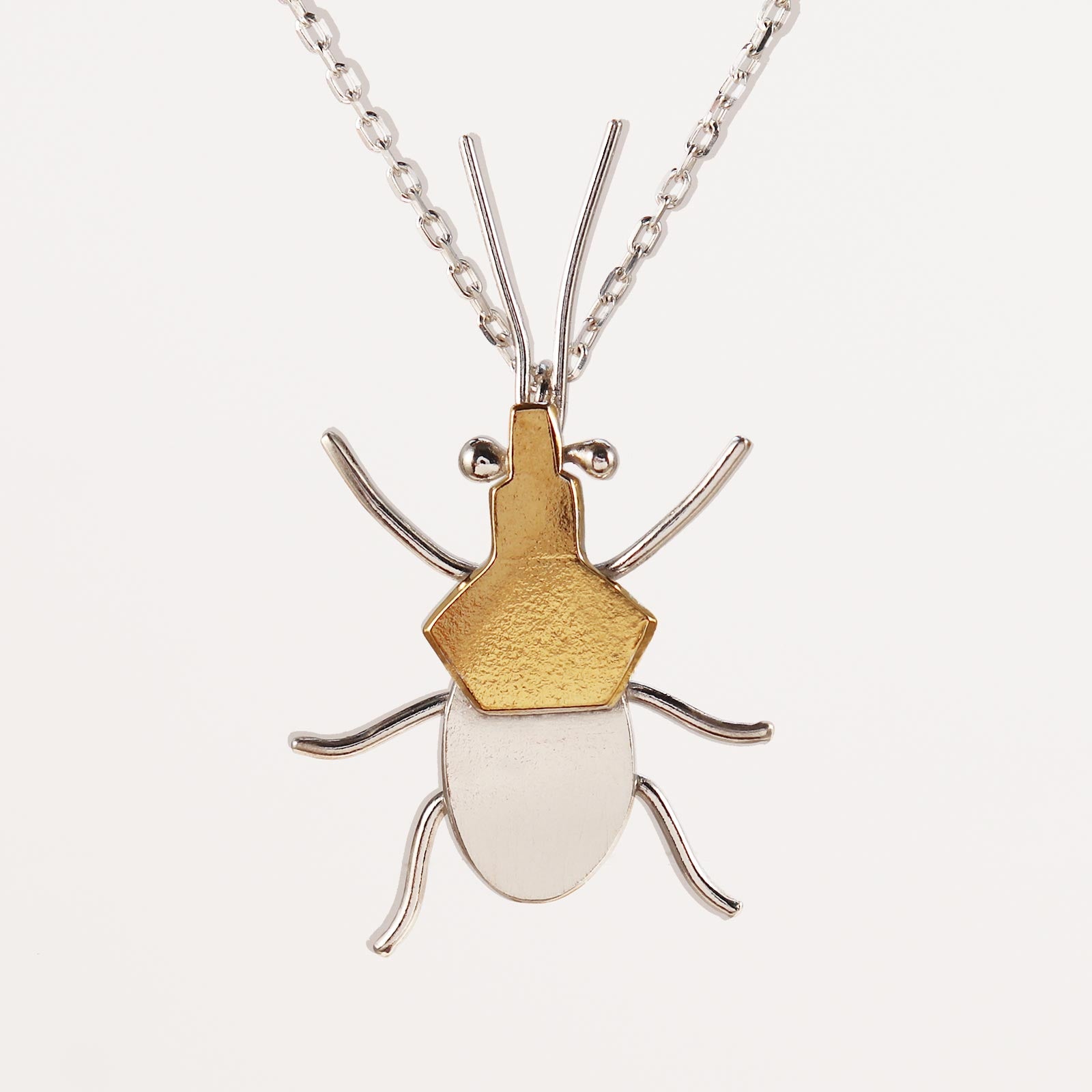 Sterling silver and gold assassin bug necklace
