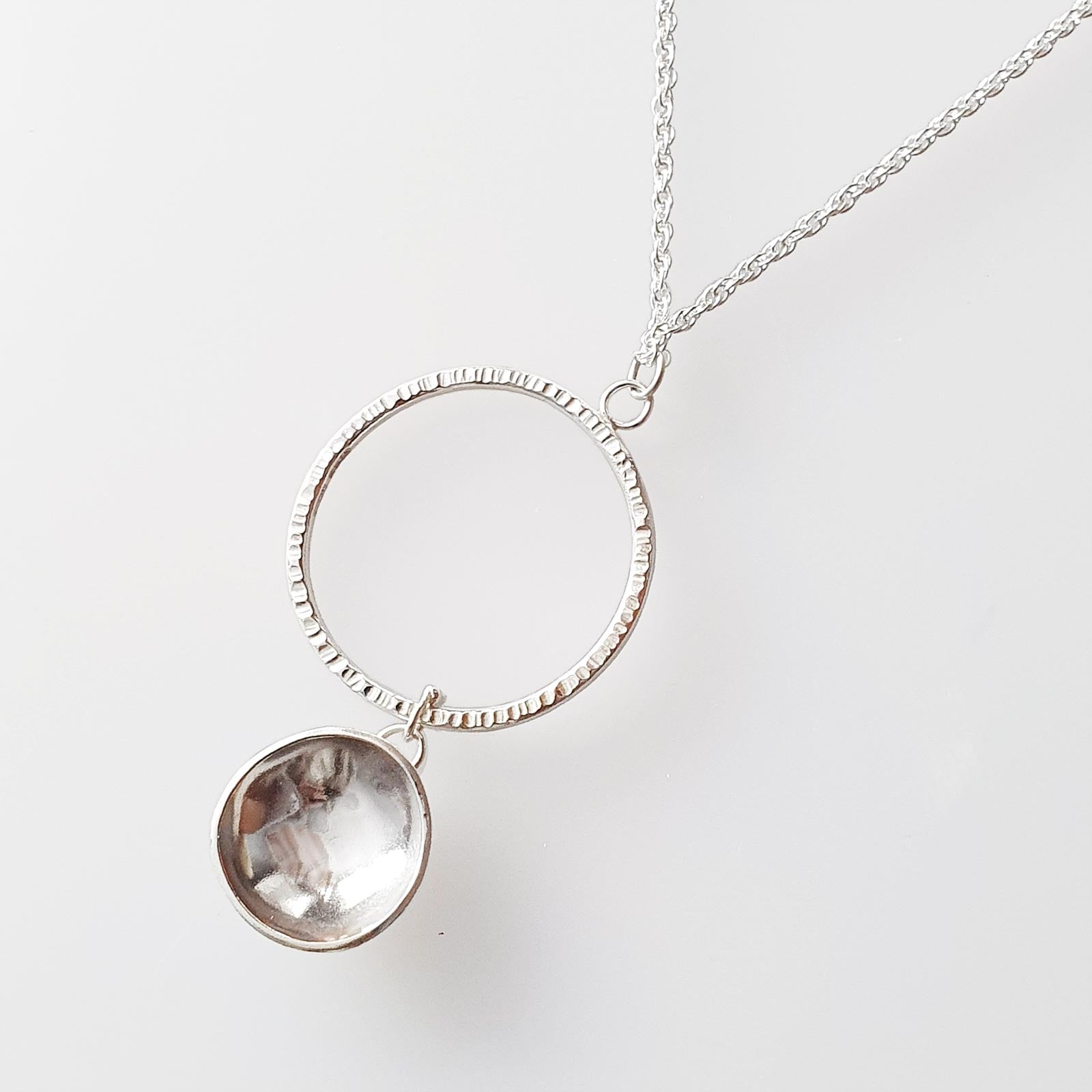 Sterling silver circle and dome pendant necklace