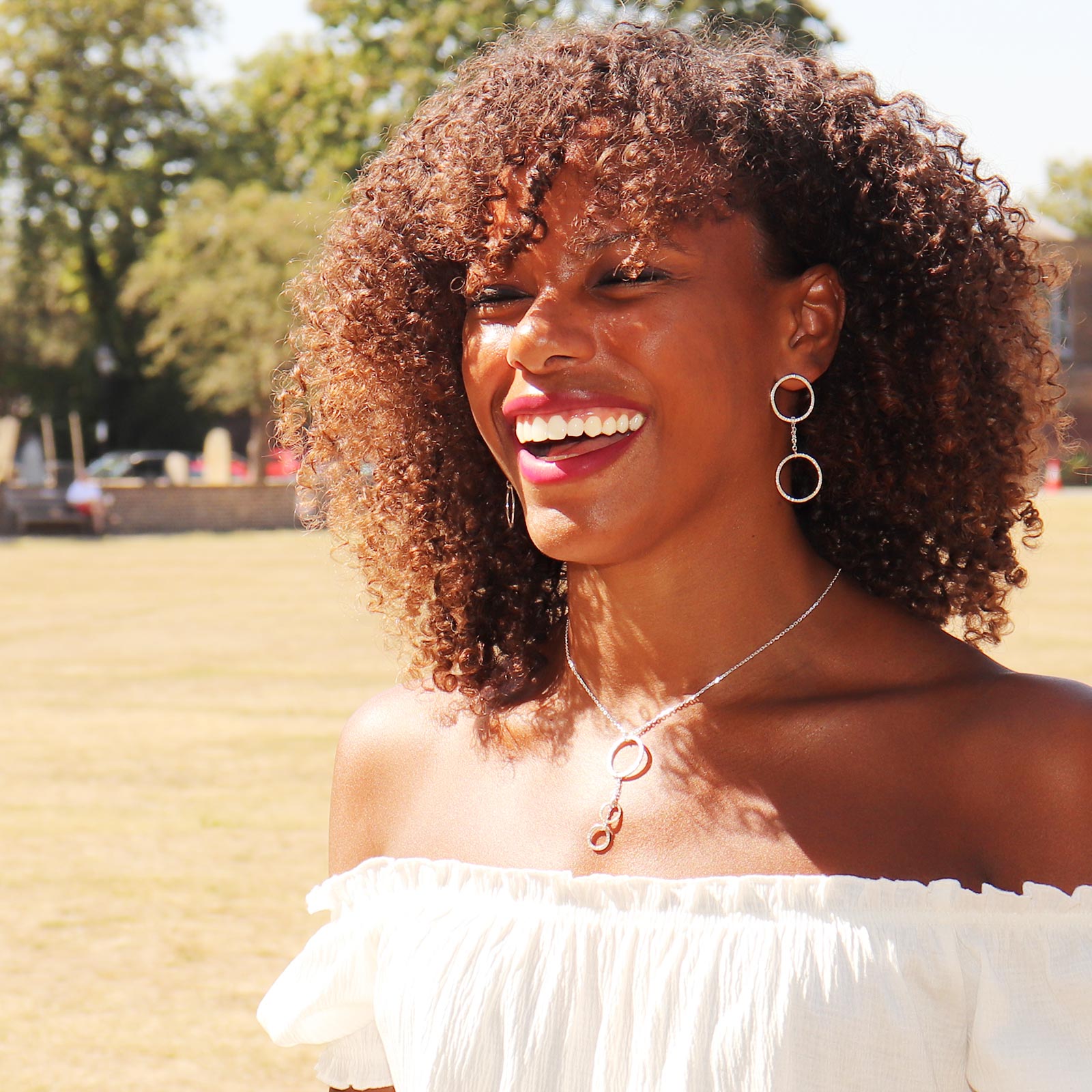 silver earrings with linked circles on model