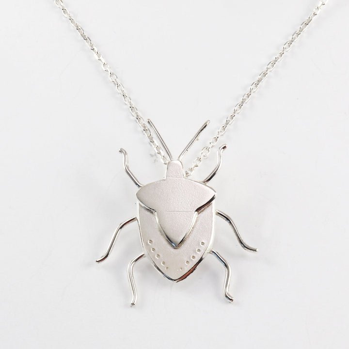 Shield bug necklace